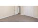 Spacious bedroom with carpet flooring and access to a bathroom at 16970 W Baker St, Surprise, AZ 85387