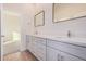 Modern bathroom with double vanity and quartz countertops at 16970 W Baker St, Surprise, AZ 85387