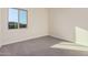 Bright bedroom with neutral walls and carpet at 16970 W Baker St, Surprise, AZ 85387