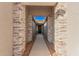 Covered entryway with stone pillars and a walkway at 16970 W Baker St, Surprise, AZ 85387