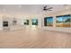 Spacious kitchen with island, stainless steel appliances, and white cabinets at 16970 W Baker St, Surprise, AZ 85387