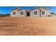 Newly constructed home with gray exterior and stone accents at 16970 W Baker St, Surprise, AZ 85387