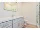 Modern bathroom with single vanity, shower and toilet at 16970 W Baker St, Surprise, AZ 85387
