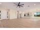 Open floor plan with kitchen, living room, and dining area at 16970 W Baker St, Surprise, AZ 85387