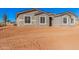 Newly constructed home with gray exterior and stone accents at 16970 W Baker St, Surprise, AZ 85387