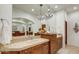 Bathroom with double sink vanity and large mirror at 3125 S First Water Ln, Gold Canyon, AZ 85118