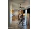 Open kitchen and dining area with ceiling fan and modern lighting at 6415 S Newberry Rd # C, Tempe, AZ 85283
