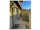 Private patio area with brick walls and small garden at 6415 S Newberry Rd # C, Tempe, AZ 85283