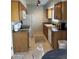 Modern kitchen featuring wood cabinets and tile backsplash at 6415 S Newberry Rd # C, Tempe, AZ 85283