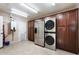 Laundry room with washer, dryer, refrigerator, and ample cabinetry at 127 E Garfield St, Tempe, AZ 85288