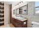 Bathroom with double sinks, granite countertop and walk-in shower at 127 E Garfield St, Tempe, AZ 85288