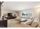 Spacious living room featuring a large sectional sofa and flat-screen TV at 127 E Garfield St, Tempe, AZ 85288