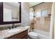 Updated bathroom with granite countertop and tile shower/tub combo at 127 E Garfield St, Tempe, AZ 85288