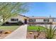Ranch-style home with landscaped lawn and walkway at 127 E Garfield St, Tempe, AZ 85288