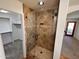 Walk-in shower with glass enclosure and tile surround at 3218 S Jackrabbit Trl, Buckeye, AZ 85326