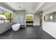 Spa-like bathroom with marble accents and a soaking tub at 6644 E Exeter Blvd, Scottsdale, AZ 85251