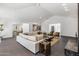 Bright living room featuring a sectional sofa and high ceilings at 6644 E Exeter Blvd, Scottsdale, AZ 85251