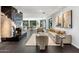 Elegant living area with a marble fireplace, comfy seating, and large windows at 6644 E Exeter Blvd, Scottsdale, AZ 85251