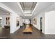 Grand entryway with a long wood statement piece and high ceilings at 6644 E Exeter Blvd, Scottsdale, AZ 85251