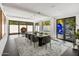 Modern dining room with large table and access to patio at 6644 E Exeter Blvd, Scottsdale, AZ 85251