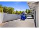 Large patio with a modern blue sculpture and plenty of space at 6644 E Exeter Blvd, Scottsdale, AZ 85251