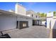 Outdoor fireplace and patio area with sleek dark tile flooring at 6644 E Exeter Blvd, Scottsdale, AZ 85251