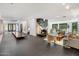 Open living room with a stunning marble fireplace and dark tile floors at 6644 E Exeter Blvd, Scottsdale, AZ 85251