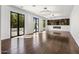 Bright living room with dark hardwood floors and fireplace at 6644 E Exeter Blvd, Scottsdale, AZ 85251