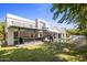 Backyard oasis with a pool, outdoor kitchen and modern staircase at 6644 E Exeter Blvd, Scottsdale, AZ 85251