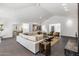 Bright living room featuring a sectional sofa and high ceilings at 6644 E Exeter Blvd, Scottsdale, AZ 85251