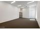 Bright office space with neutral carpeting and built-in shelving at 6644 E Exeter Blvd, Scottsdale, AZ 85251