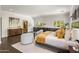 Elegant bedroom with dark hardwood floors and a sitting area at 6644 E Exeter Blvd, Scottsdale, AZ 85251