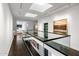 Modern glass-railed hallway with natural light and artwork at 6644 E Exeter Blvd, Scottsdale, AZ 85251
