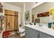 Updated bathroom with shower/tub combo, vanity, and decorative accents at 19104 N Smith Dr, Maricopa, AZ 85139
