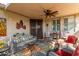 Relaxing covered patio with seating and ceiling fan at 19104 N Smith Dr, Maricopa, AZ 85139