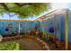 Landscaped backyard with decorative accents and fountain at 19104 N Smith Dr, Maricopa, AZ 85139