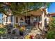 Extended patio with seating area and lush landscaping at 19104 N Smith Dr, Maricopa, AZ 85139