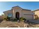 Single-story home with two-car garage and desert landscaping at 19104 N Smith Dr, Maricopa, AZ 85139