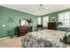 Main bedroom with plush carpet, large bed, and plenty of natural light at 19104 N Smith Dr, Maricopa, AZ 85139