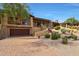 Two-story home with attached garage and desert landscaping at 27440 N Alma School Pkwy # 33-2, Scottsdale, AZ 85262