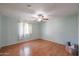 Bedroom featuring wood floors and a ceiling fan at 8334 N 55Th Ave, Glendale, AZ 85302