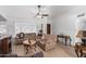 Living room with sectional sofa, coffee table, and fireplace at 4701 W Aire Libre Ave, Glendale, AZ 85306