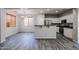 Modern kitchen with stainless steel appliances and an island at 7017 S 7Th Ln, Phoenix, AZ 85041