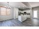 Modern kitchen with white cabinets and a breakfast bar at 7017 S 7Th Ln, Phoenix, AZ 85041