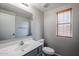 Clean bathroom with white vanity and single sink at 7017 S 7Th Ln, Phoenix, AZ 85041