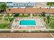 Community pool with surrounding patio furniture at 711 E Laurel Dr # 21, Casa Grande, AZ 85122