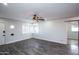 Spacious living area with hardwood floors and barn door at 2501 E Campbell Ave, Phoenix, AZ 85016