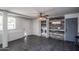 Bright laundry room with stacked washer and dryer and barn door at 2501 E Campbell Ave, Phoenix, AZ 85016