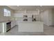 Bright kitchen featuring white cabinets and tile floors at 527 W Mobile Ln, Phoenix, AZ 85041