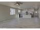 Modern kitchen with white shaker cabinets, island, and stainless steel appliances at 527 W Mobile Ln, Phoenix, AZ 85041